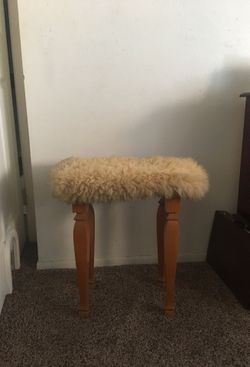 Wooden stool with fur