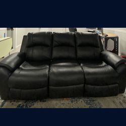Leather Reclining sofa in charcoal leather. Gotham series