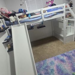 Twin loft bed with slide and stair case storage