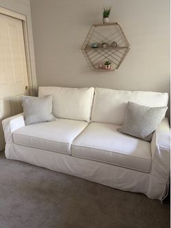 Beautiful Pottery Barn (hardly used)Cream slipcover Sleeper Sofa for sale