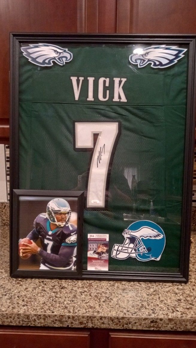 MICHAEL VICK OF THE PHILADELPHIA EAGLES CUSTOM STITCHED, SIGNED JERSEY WITH COA IN DISPLAY CASE.