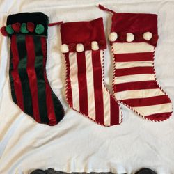 Three Candy Cane Stripped Holiday Stockings 