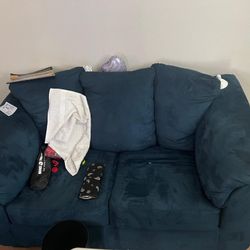 Spring Matress And Blue Couch 