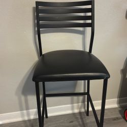 pair of steel and leather high chairs $55
