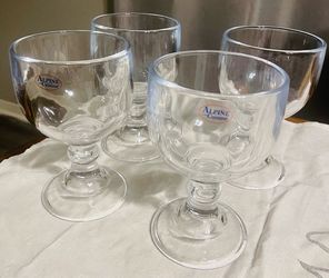 The glasses shown are thick, heavy clear glass schooner or margarita goblets,.