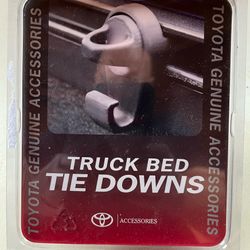 NEW in package. Toyota Mini Tie-Downs with Hooks.