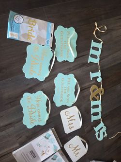 Teal and gold wedding signs