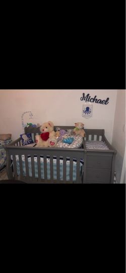 Gray Baby Crib with Attached Changing Table