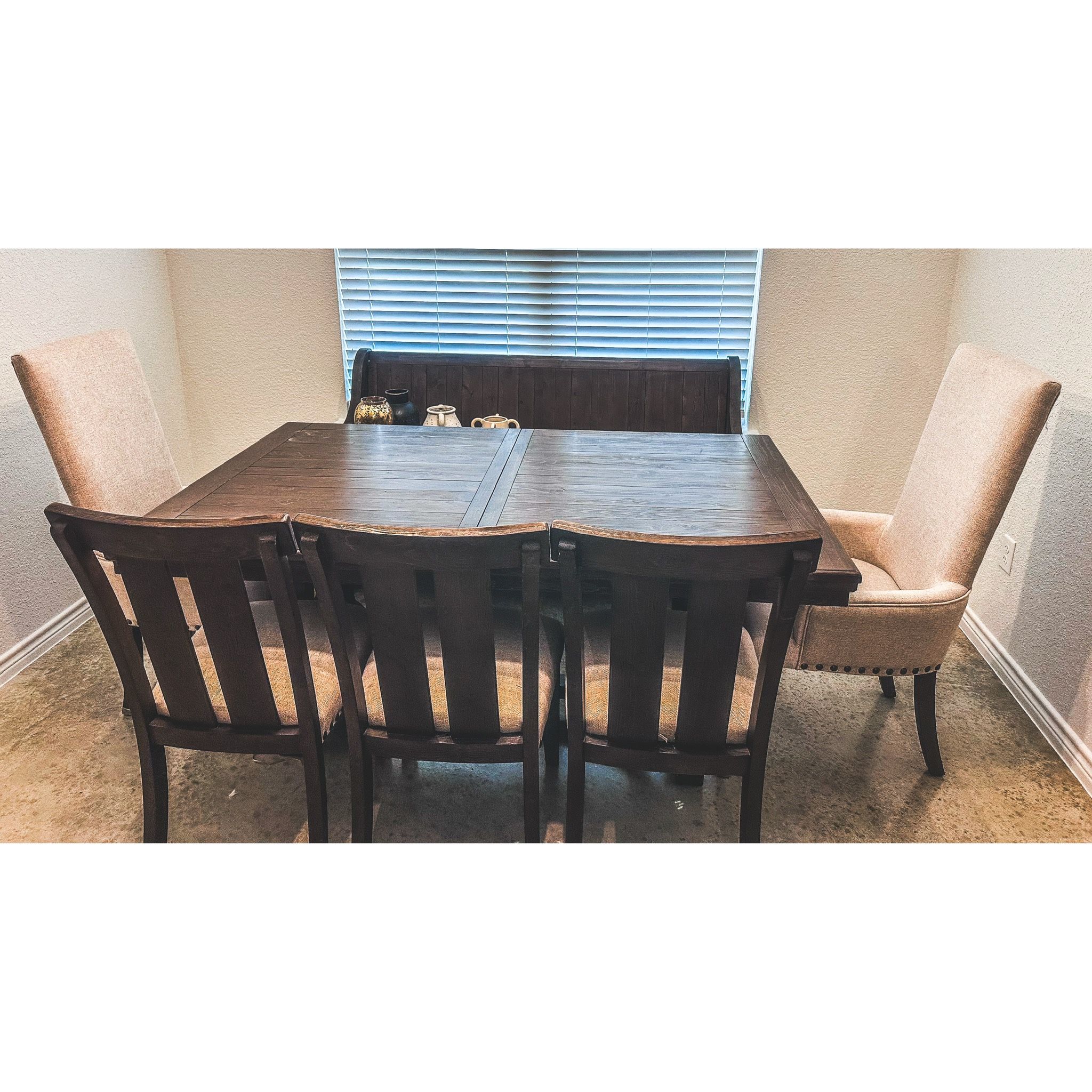 Ashley farmhouse dining room set with seating for 8-10. Includes table leaf, bench,3 cushioned chairs and 2 upholstered chairs. Only blemish is shown