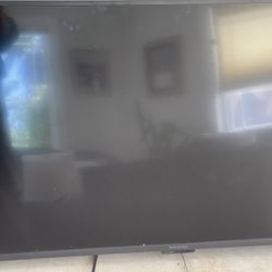 Insignia 43” Tv With Wooden Base With Wheels & White Stand , Looking Very Elegant 