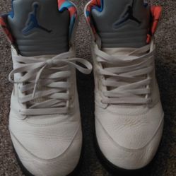 Air Jordan 5 Retro "International Flight" "Sail/Orange Peel" colorway).