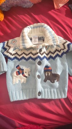 $5 BABY'S SWEATER SIZE 0-3 MONTHS