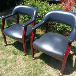 Pair Of Leather Rolling Chairs On Wheels