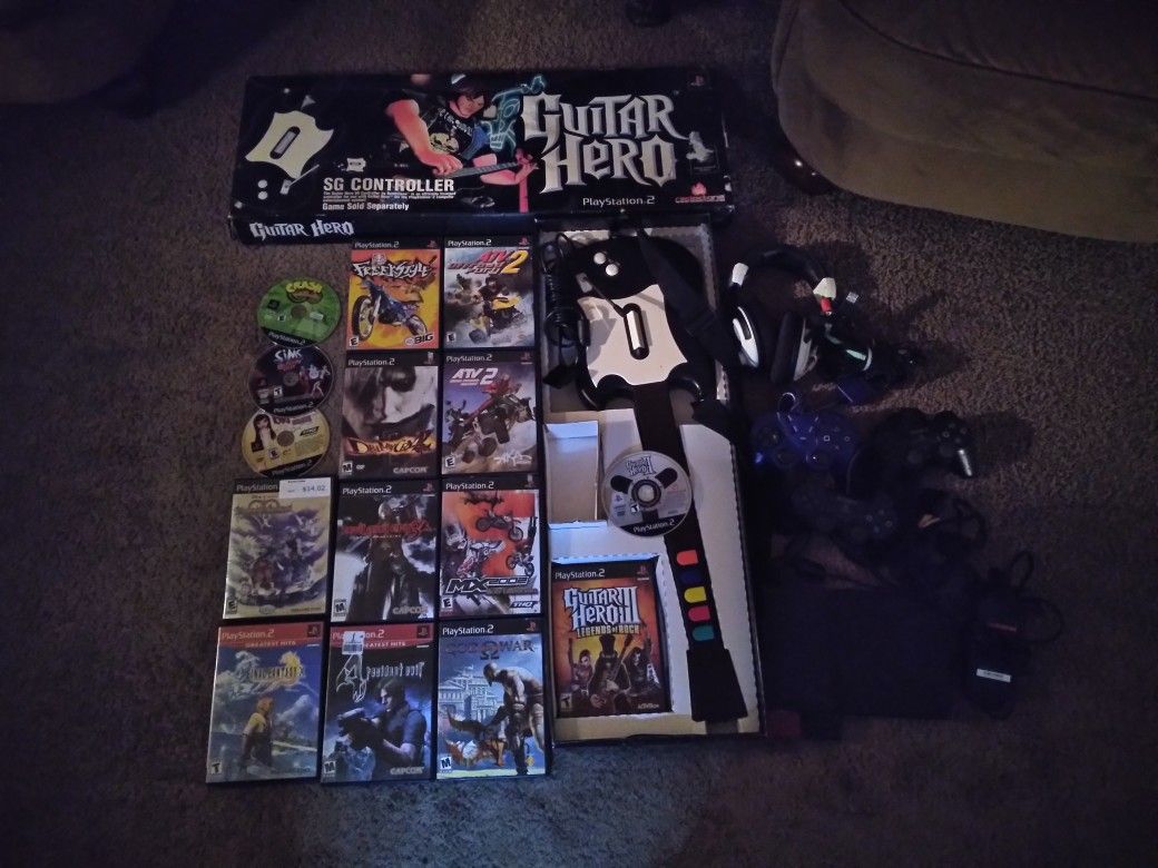 Playstation 2 slim Ps2 Guitar Hero Black Wired Controller Sg SA with 15 games 3 controllers and headphones $125