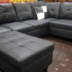Black Leather Sectional With Storage Ottoman