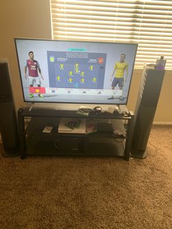 TV Stand. Can fit up to 50in TV
