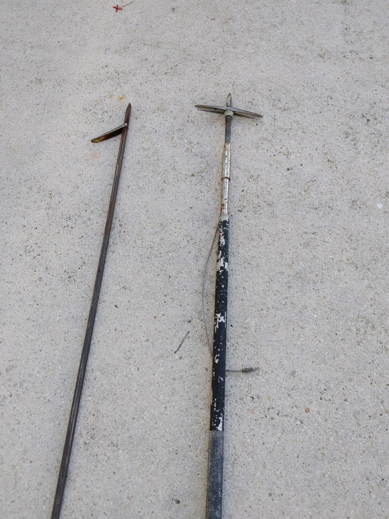 Pre owned lot of two fishing spears