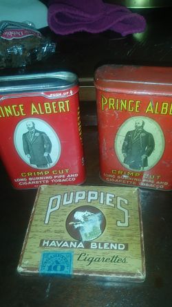 2 -Price Albert cans and an unopened pack of cigarettes from 1942