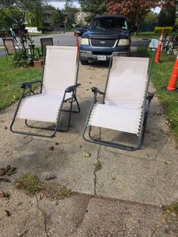 Two extra wide zero gravity lounge chairs.. prices firm