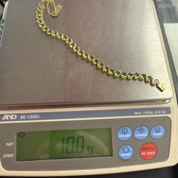 14 karat yellow gold, tennis bracelet gemstones