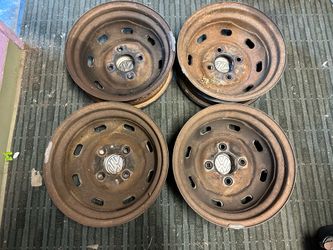 4 lug VW bug or beetle 15 inch rims with chrome caps and trim rings