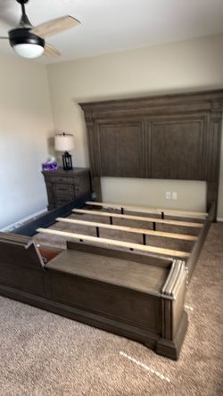 Living Spaces king size bedroom, set with built-in sitting benches cedar chest at the footboard