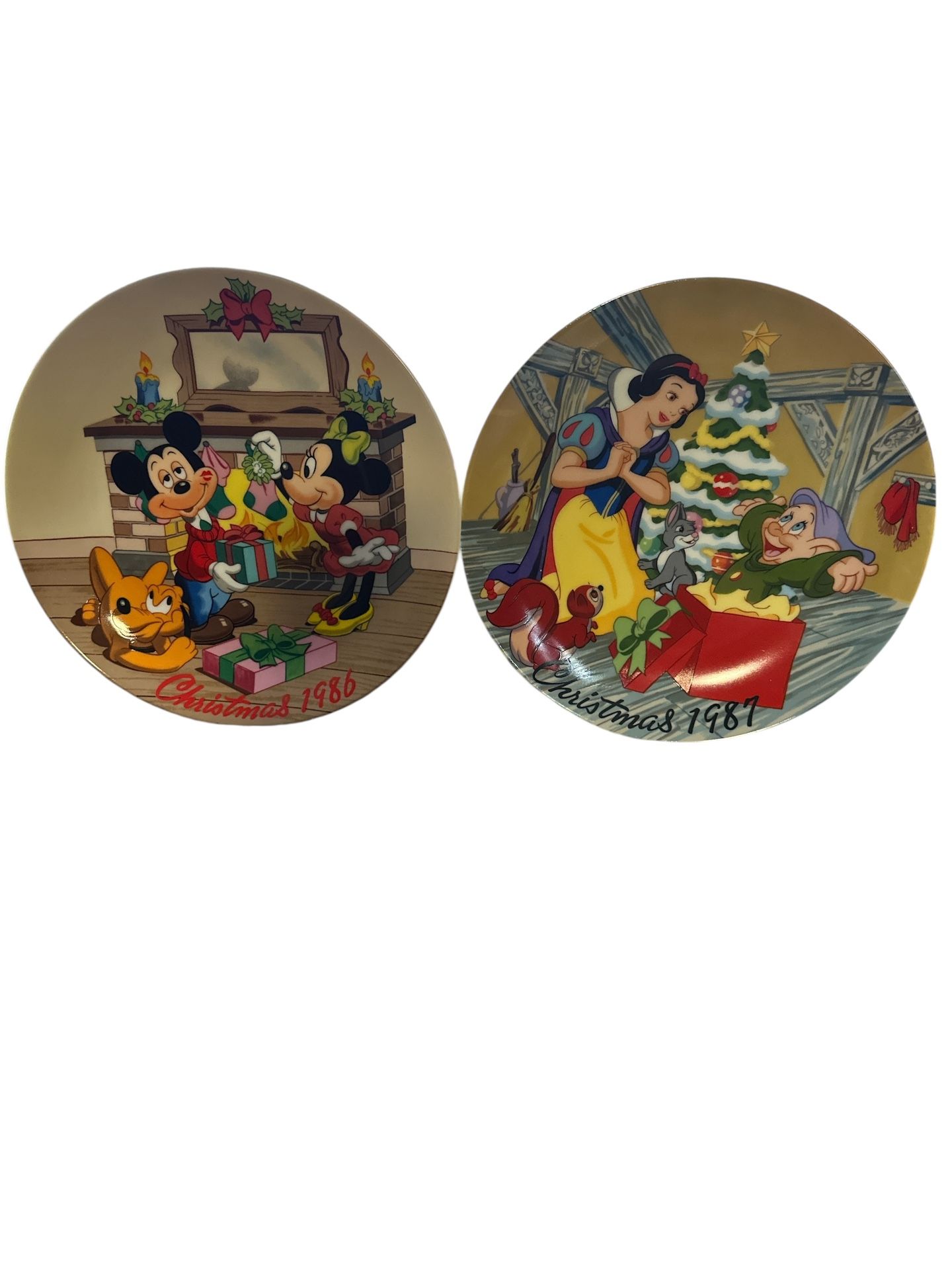 limited edition collector's plate from 1987 called "Snow White's Surprise". And Mistletoe Magic" Christmas plate from 1986, featuring Mickey Mouse and