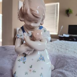 Girl Holding Doll
