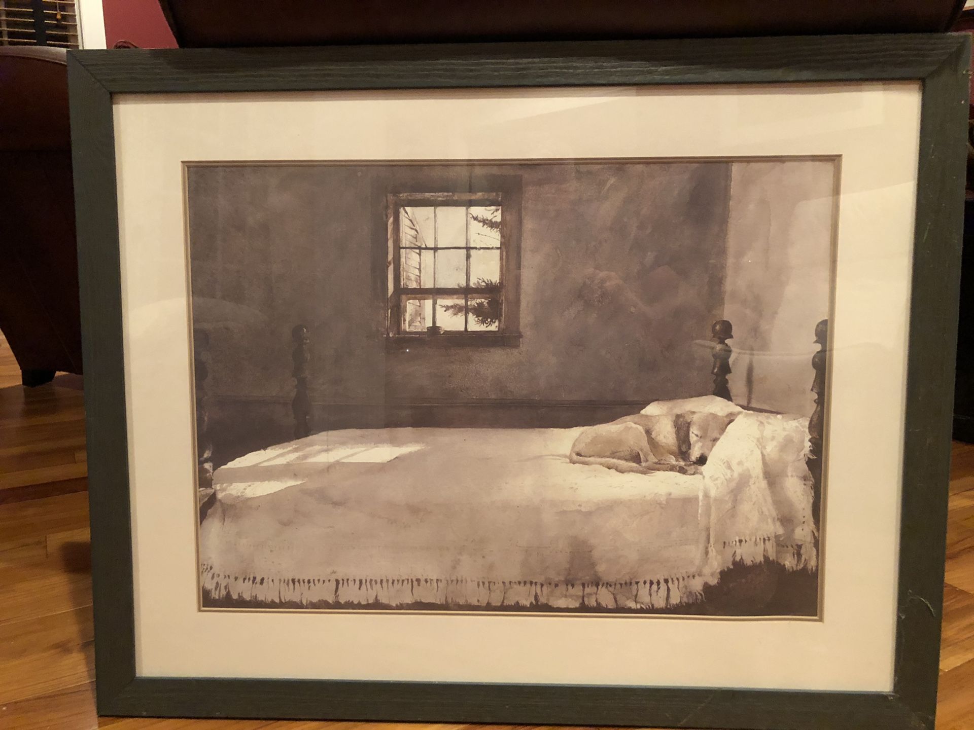 Lab on bed frames and matted print.