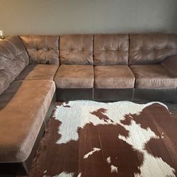 Brown Section With Ottoman And Faux Cowhide