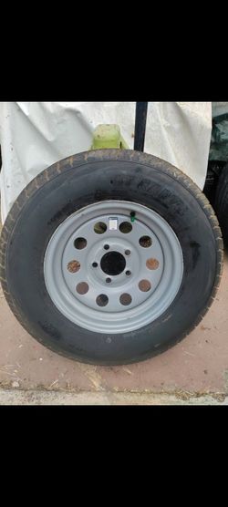 Trailer rim and tire st205/75/14 (brand new )