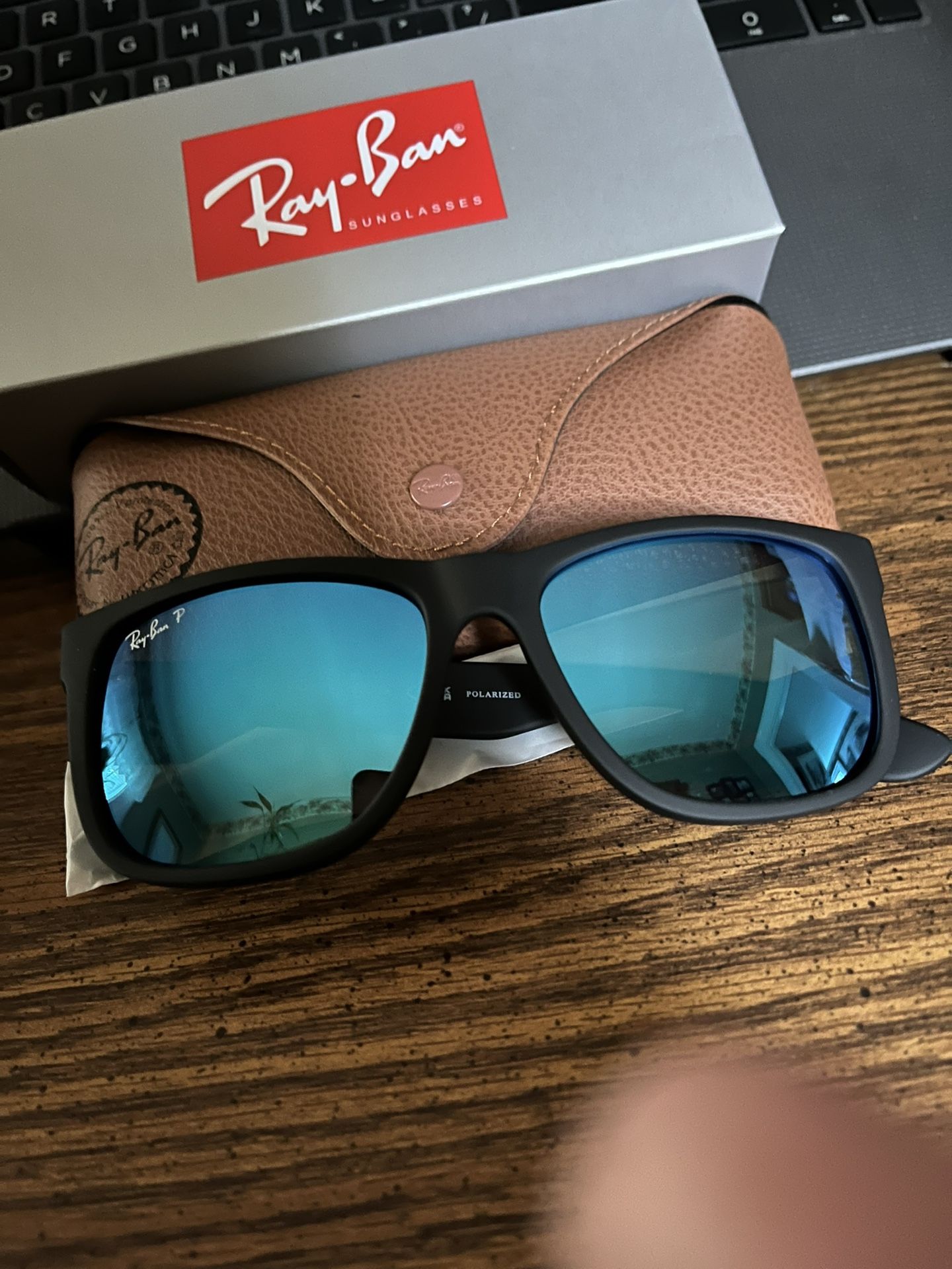 RAY BAN JUSTIN’S - BLACK FRANE w/ POLARIZED ICE BLUE MIRROR LENSES. 55mm. BRAND NEW IN BOX.