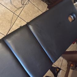 Black leather massage table