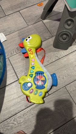 Dinosaur play electronic guitar
