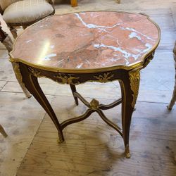 Curio Louis XV Side Table LOOK UP A French Louis XV style side table with Griotte marble top and gilt bronze mounts. TIME PERIOD 19th Century ORIGIN F