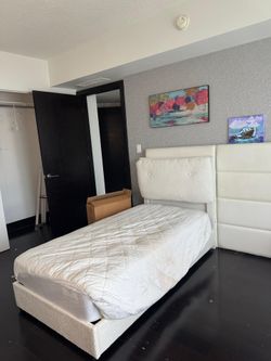 Two twin beds with mattresses