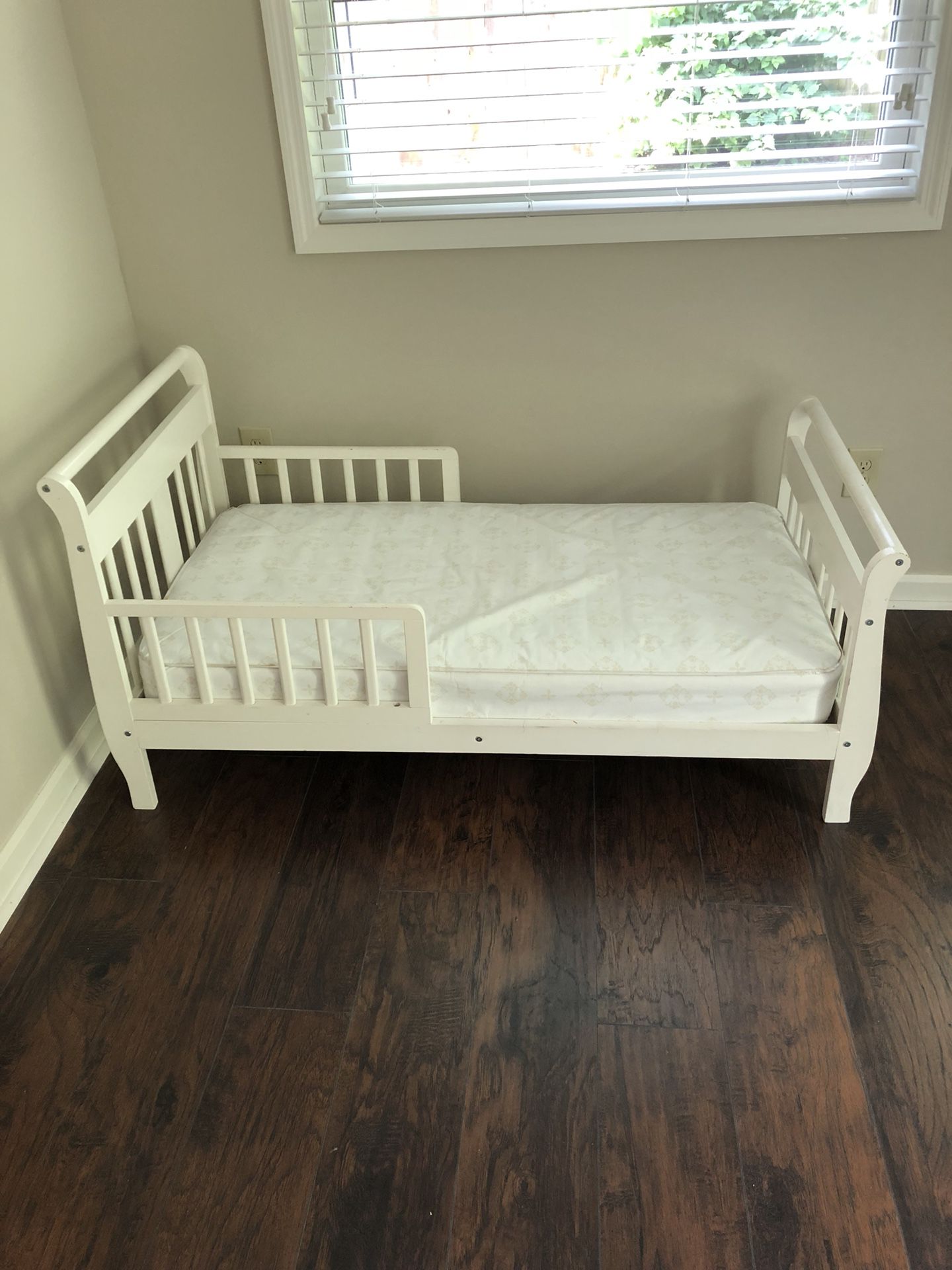 White toddler bed and mattress