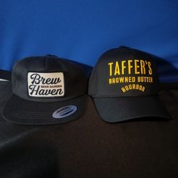 2 Adult Hats (Taffers & Brew Haven)
