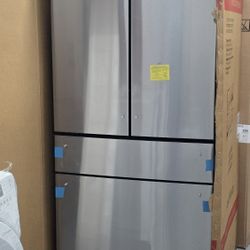 Brand new GE Cafe 4 door refrigerator with water dispenser inside 