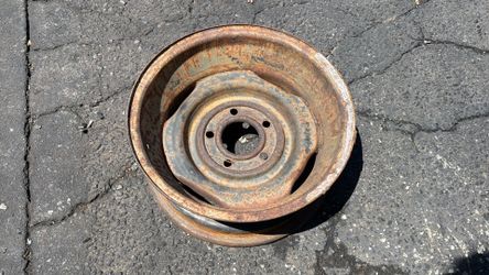 One original 1950s Or 1960s Cadillac 15 Inch stock Steel wheel