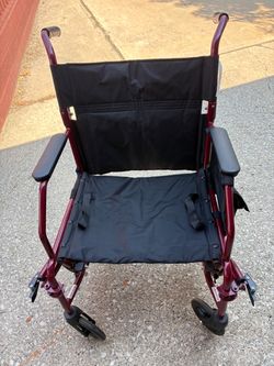 Transport folding wheelchair