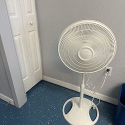 White Lasko standing fan 