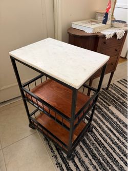 Rolling cart with marble top and wood shelves