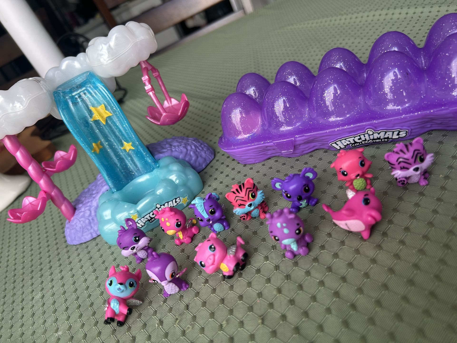 cartoon of 12 Hatchimals and Waterfountain Lights turn on