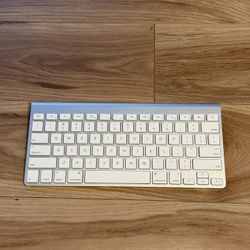 Apple Silver Wireless Keyboard. Its sleek design and responsive keys make it perfect for any workspace. Used But In Good Condition. Uses AA batteries.