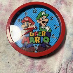 This item is a 10-inch analog wall clock featuring characters Mario and Luigi from the Nintendo Super Mario Bros. franchise.