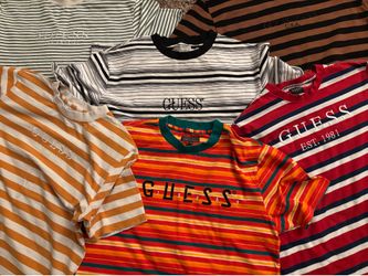 A bunch of Guess Shirts