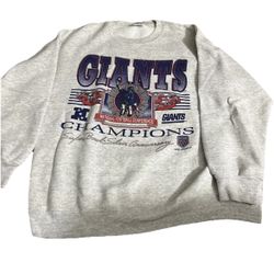 vintage 1990 New York Giants Super Bowl XXV Champions sweatshirt, produced by brands such as Nutmeg, Salem Sportswear, or Logo 7. This merchandise com