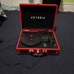 Red Victrola suitcase record player