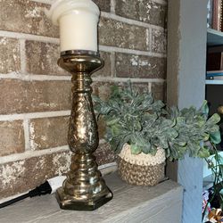 Gold Candlestick And Fake Plant